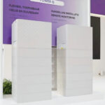 Thumbnail of  Twee witte FoxESS Power Q All-in-one thuisbatterijsystemen op een beursstand.